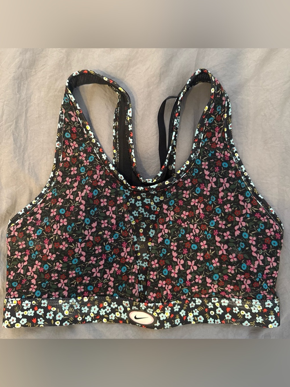 Nike Floral Racerback Sports Bra in Black with Pink & Teal Accents
